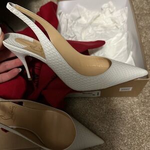 White Christian Louboutin slingbacks